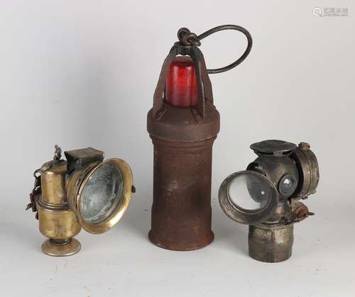 Three antique (carbide) lamps