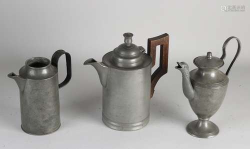 Three tin jugs