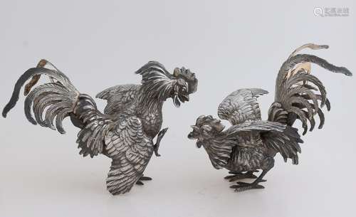 Two silver roosters