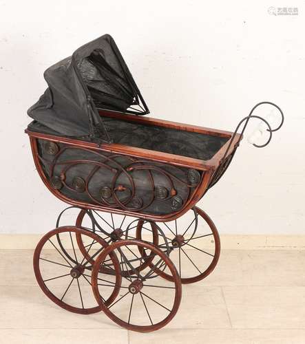 Doll pram with porcelain handle.