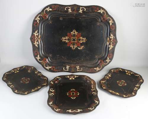 Four painted trays