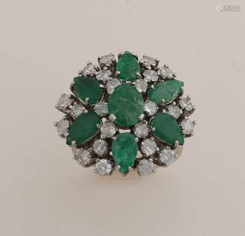 White gold ring with diamond and emerald