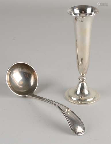 Silver spoon and vase