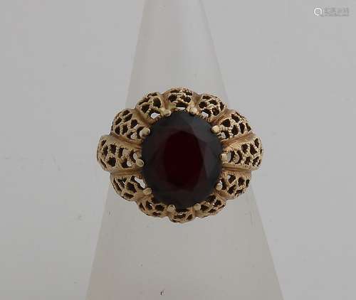 Gold ring with garnet