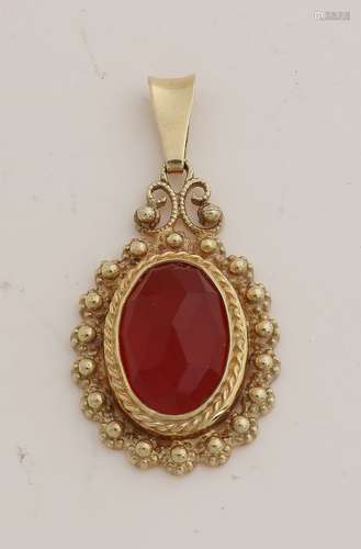 Gold pendant with carnelian