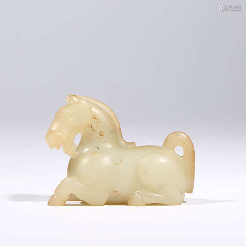 A CHINESE WHITE JADE RECUMBENT HORSE