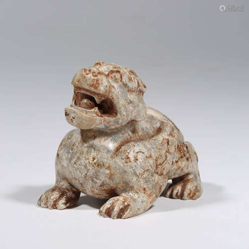 A CHINESE JADE CARVING OF A RECUMBENT BEAST