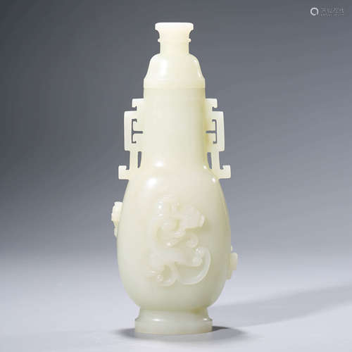 A CHINESE WHITE JADE CARVING OF A VASE AND COVER