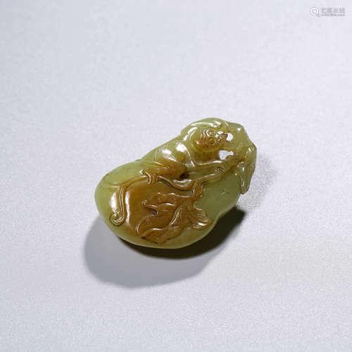 A CHINESE YELLOW JADE MELON AND MONKEY PENDANT