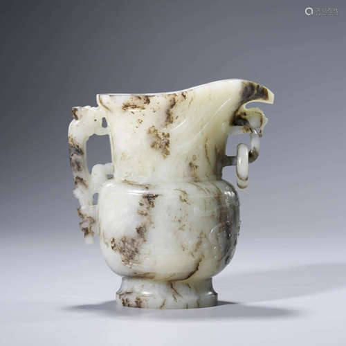 A CHINESE WHITE JADE ARCHIASTIC WINE VESSEL