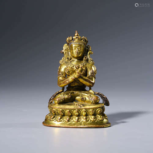 A CHINESE GILT-BRONZE VAJARDHAR STATUE