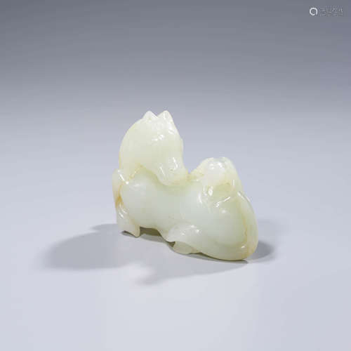 A CHINESE WHITE JADE HORSE AND MONKEY ORNAMENT