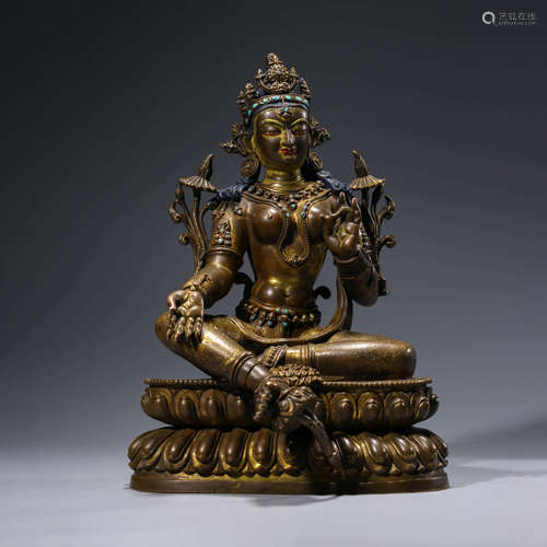 A CHINESE BRONZE GREEN TARA STATUE