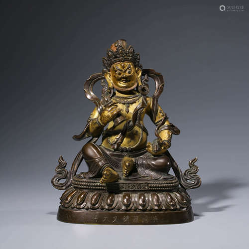 A CHINESE BRONZE YELLOW JAMBHALA STATUE