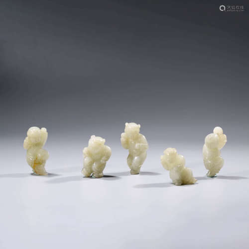 A SET OF CHINESE LIAO DYNASTY WHITE JADE CHILDREN ORNAMENTS