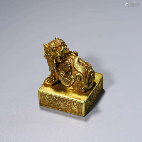 A CHINESE GILT-BRONZE LION SEAL