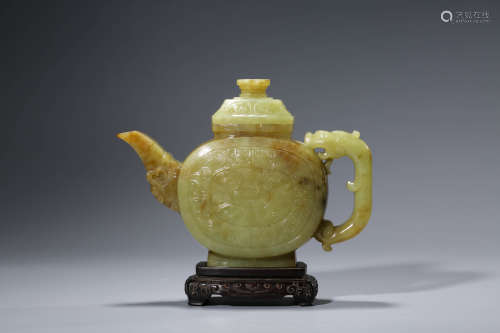 A CHINESE YELLOW JADE WINE VESSEL AND STAND