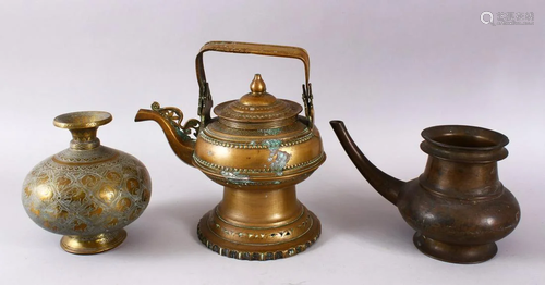 THREE INDIAN BRASS EWERS, various sizes.