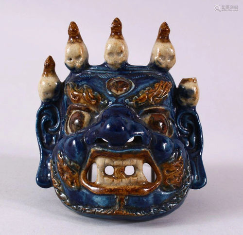 A JAPANESE MEIJI PERIOD HIRADO POTTERY MASK OF A DEMON