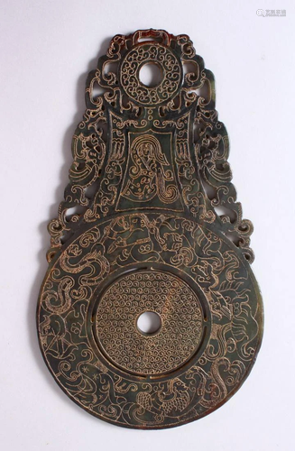 A CHINESE CARVED JADE BI DISK, carved with archaic