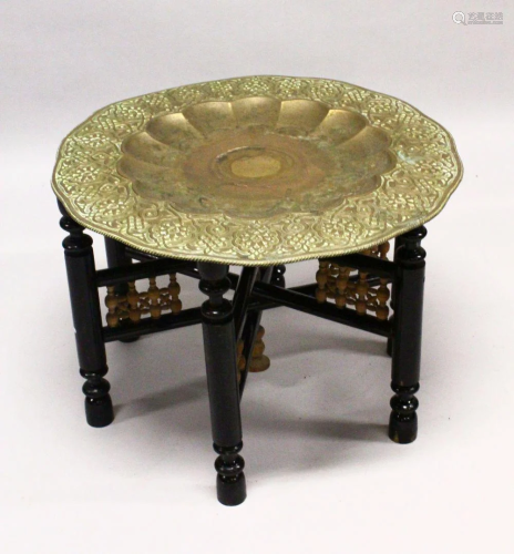 A GOOD LARGE ISLAMIC BRASS TRAY TABLE AND FOLDING