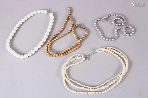 A MIXED LOT OF FOUR CARVED PEARL NECKLACES, (4)