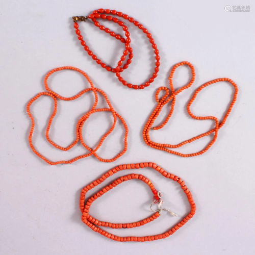 A MIXED LOT OF FOUR CHINESE CARVED RED NECKLACES,