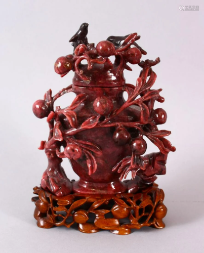 A CHINESE CARVED PINK & BLACK RHODONITE VASE & COVER,
