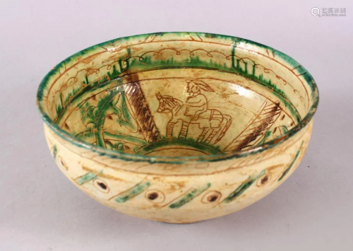 A GOOD IRAN STYLE POTTERY BOWL, decorated with green &