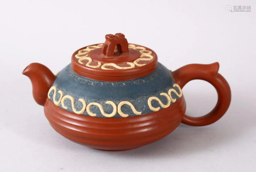 A CHINESE YIXING CLAY TEAPOT, with moulded and poly