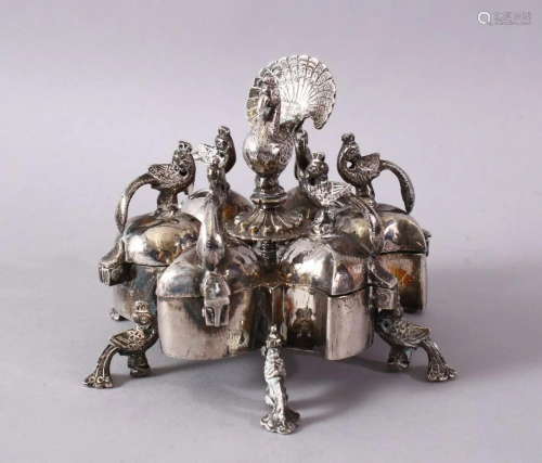 AN INDIAN WHITE METAL SIX CONTAINER SPICE BOX, with