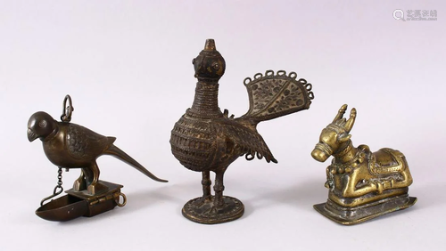 AN INDIAN BRASS NANDI BULL, together with a bird oil