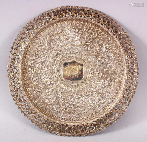 AN INDIAN WHITE METAL DISH,possibly silver , with