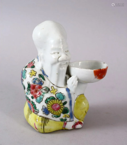 A CHINESE FAMILLE JAUNE / ROSE PORCELAIN FIGURE OF SHOU