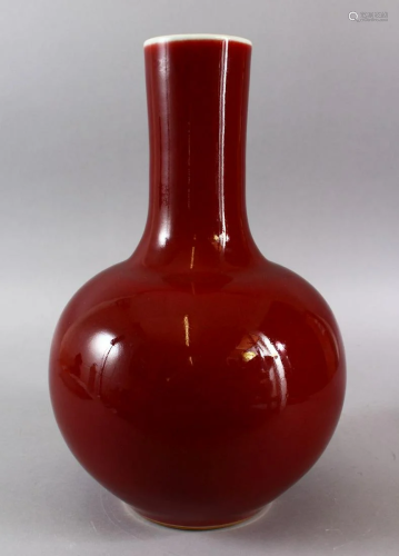 A CHINESE COPPER RED KANGXI STYLE BOTTLE VASE, the base