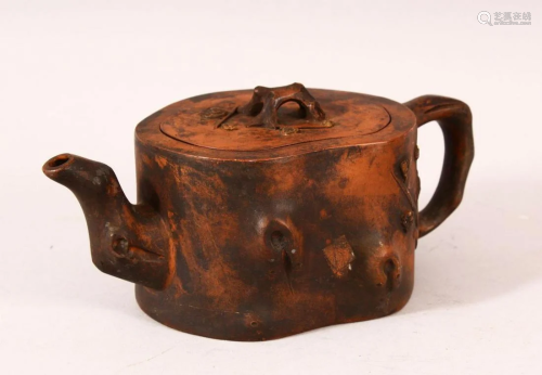 A CHINESE YIXING TEAPOT, of naturalistic form, 20cm