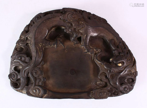 A 19TH CENTURY CHINESE SHAPED INKSTONE, carved with