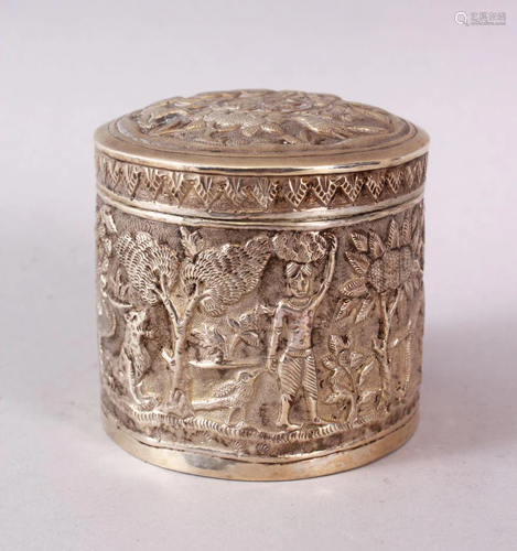 AN INDIAN CALCUTTA WHITE METAL CIRCULAR LIDDED BOX &