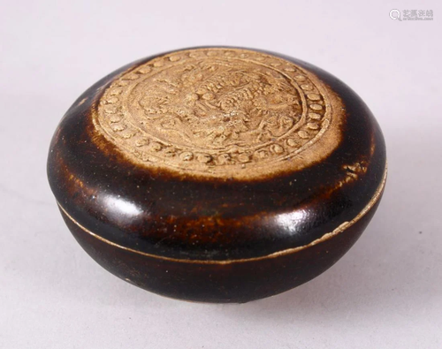 A SMALL CHINESE TREACLE GLAZED CIRCULAR POTTERY BOX AND