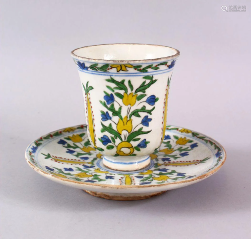 A TURKISH KUTAHYA POTTERY CUP & SAUCER, decorated with