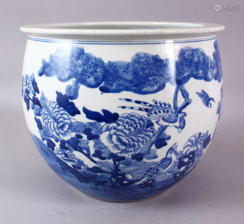 A CHINESE BLUE AND WHITE JARDINIERE, painted with birds