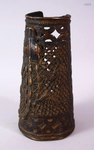 AN UNUSUAL BENIN BRONZE ARM GUARD, relief cast and