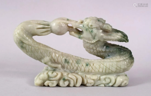 A CHINESE CARVED SOAPSTONE FIGURE OF A DRAGON…