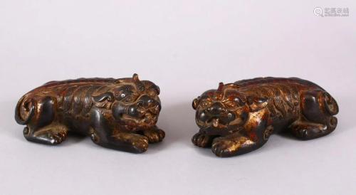 TWO CHINESE BRONZE FIGURES OF LION DOGS, each gilded