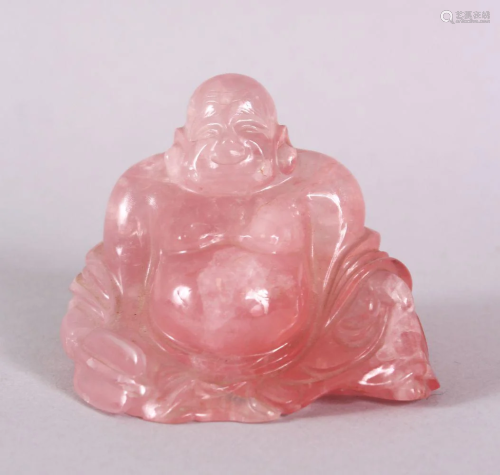 A CHINESE CARVED ROSE QUARTS FIGURE OF BUDDHA, in a