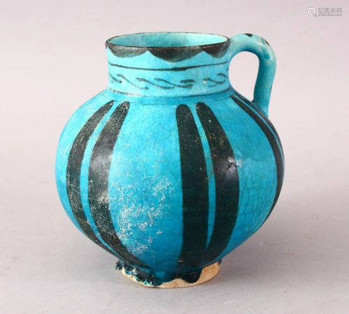 A GOOD EARLY ISLAMIC RAQQA POTTERY EWER, with a blue