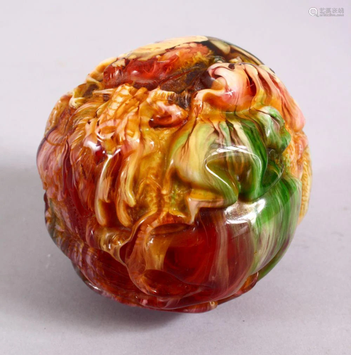 A CHINESE CARVED BAKELITE OR CHERRY AMBER ZODIAC BALL,