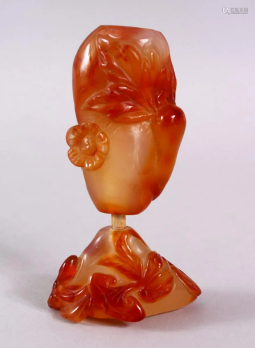 TWO CHINESE CARVED AGATE SNUFF BOTTLES, One carved with