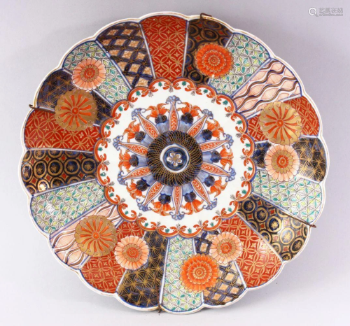 A JAPANESE IMARI CHARGER, with shaped edge, painted