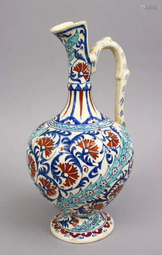 A GOOD POTTERY FLORAL DECORATED EWER FOR THE ISLAMIC